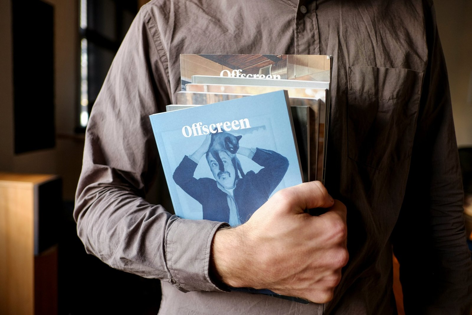 consulting agency man holding blue book on how to